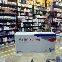 A box of Astin 20 mg tablets containing Atorvastatin for cholesterol management.